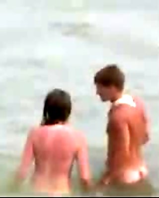Totally naked teenager on spy beach